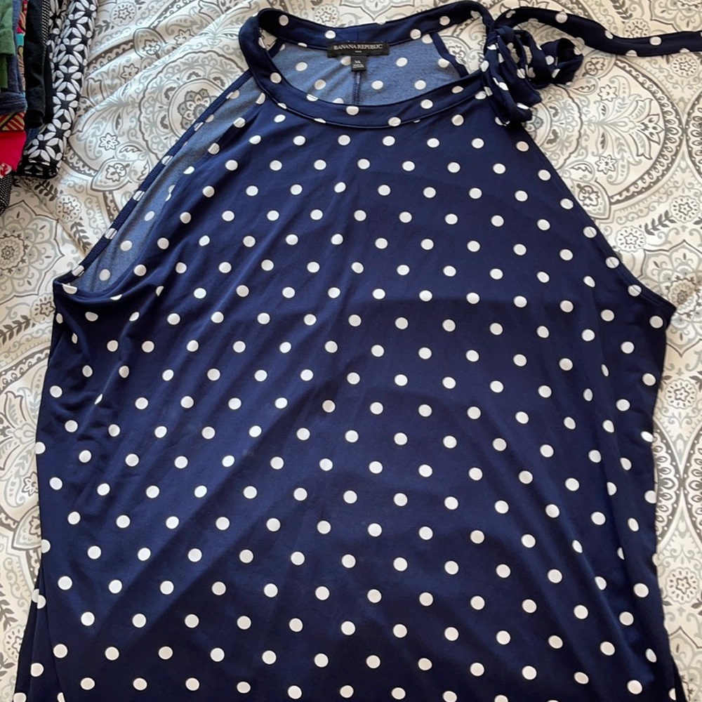 Blue and white polka dot sleeveless top